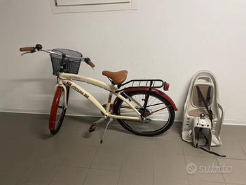 Bicicletta con seggiolino