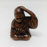 netsuke legno di bosso cantastorie 