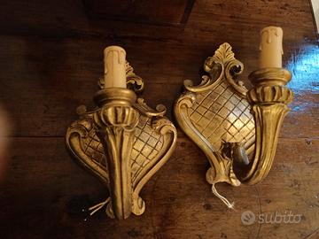 coppia appliques in legno intagliato