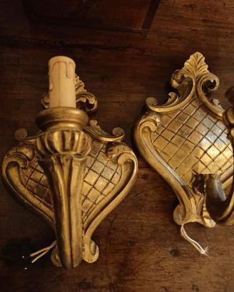 coppia appliques in legno intagliato