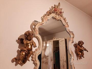 Coppia di putti musicanti in legno dorato