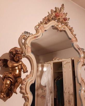 Coppia di putti musicanti in legno dorato