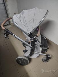 Passeggini + seggiolone + triciclo + sacco nanna