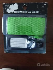 Cinghia e cartellino per bagagli