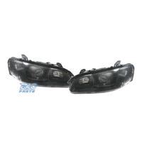 FARI PER OPEL OMEGA 94-99 LENTE A LENTE NERA