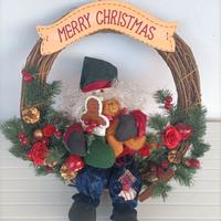 Ghirlanda natalizia con Babbo Natale che canta 