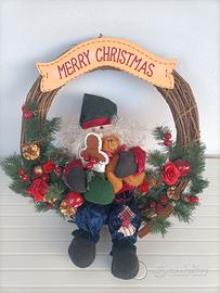 Ghirlanda natalizia con Babbo Natale che canta 