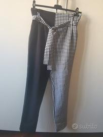 pantalone nero e a scacchi bianco e nero 