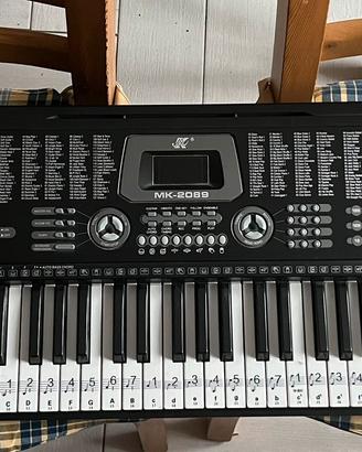 Pianola/ tastiera per pianoforte + flauto e libri