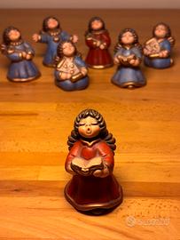 Thun angelo ceramica rosso con libro