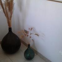 Boccioni da vino vintage e portabottiglie