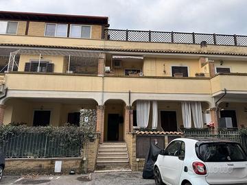 Appartamento e posto auto in asta a Fiumicino RM