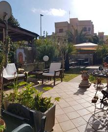 Appartamento con veranda e giardino