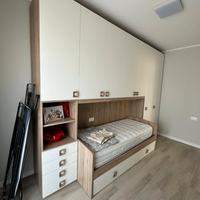 Camera a ponte 6 ante con letto a scomparsa