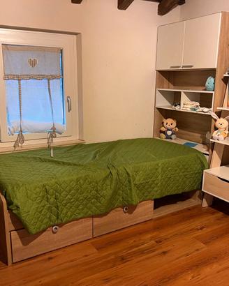 Camerette gemelle con armadi e letto contenitore