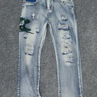 Jeans Amiri con ricamo 🐍