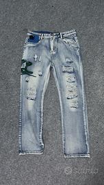 Jeans Amiri con ricamo 🐍