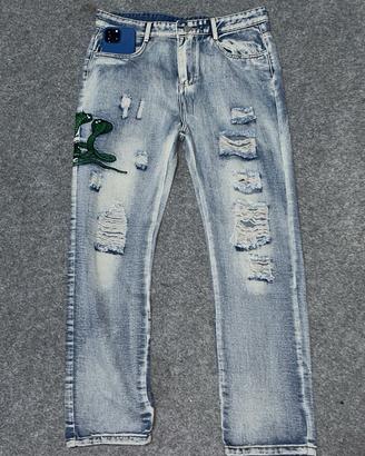 Jeans Amiri con ricamo 🐍
