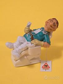 Statuina caricatura dentista