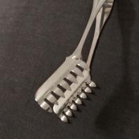 Pinza per spaghetti in argento stile inglese.