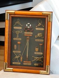 quadro in legno e ottone con nodi marinari