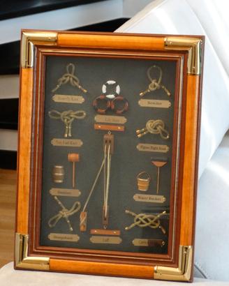 quadro in legno e ottone con nodi marinari