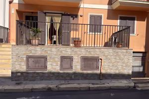 Immobile al piano terra con posto auto e veranda