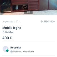 Parete salone in legno e  vetrinette.