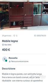 Parete salone in legno e  vetrinette.