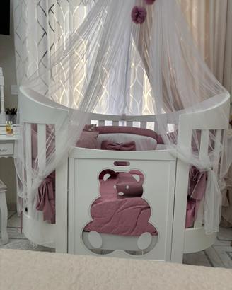 Culla ovale trasformabile con baldacchino paracolp