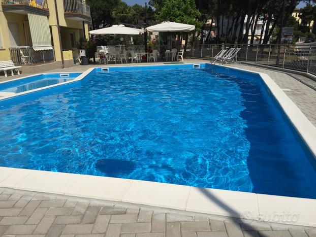 Appartamento bilocale 5letto-150M dal mare-PISCINA