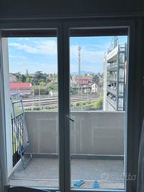 Porta scorrevole alluminio vetro doppio