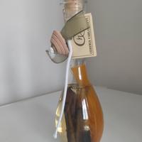 Candela di olio con piuma