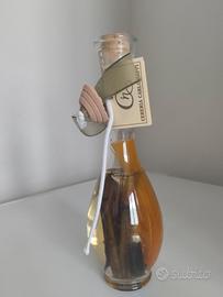 Candela di olio con piuma