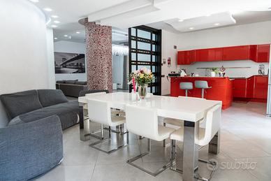 Appartamento con Terrazzo, Giardino e Posto Auto