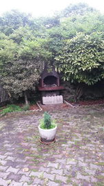 Appartamento con giardino a mezzenile