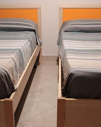 letti singoli e letto matrimoniale contenitore