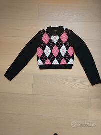 maglione rosa e nero con texture a quadri