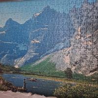 puzzle incorniciato montagne e lago pescatore
