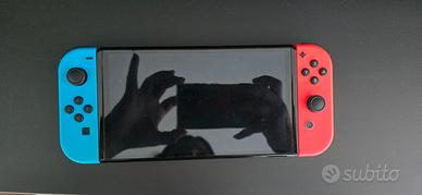 Nintendo switch oled+giochi+2 joypad+custodia