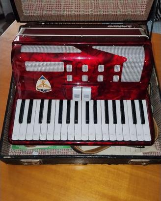 Fisarmonica vintage rossa con custodia rigida