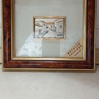 Placca in argento con cornice in legno