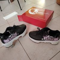Scarpe con rotelle retraibili/roller