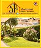 ampio-giardino-angolare-con-grande-garage