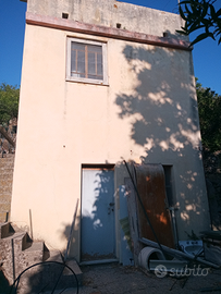 Terreno con deposito e vasca di raccolta CATASTATO