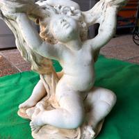 Tavolo in vetro con putti in cemento