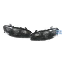 FARI PER OPEL OMEGA 94-99 LENTE A LENTE NERA