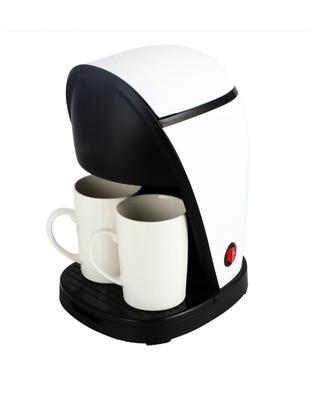macchina da caffè con due tazze in ceramica