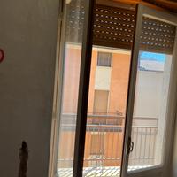 Infissi porta balcone in legno