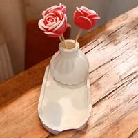 vaso in gesso con candele- bomboniere